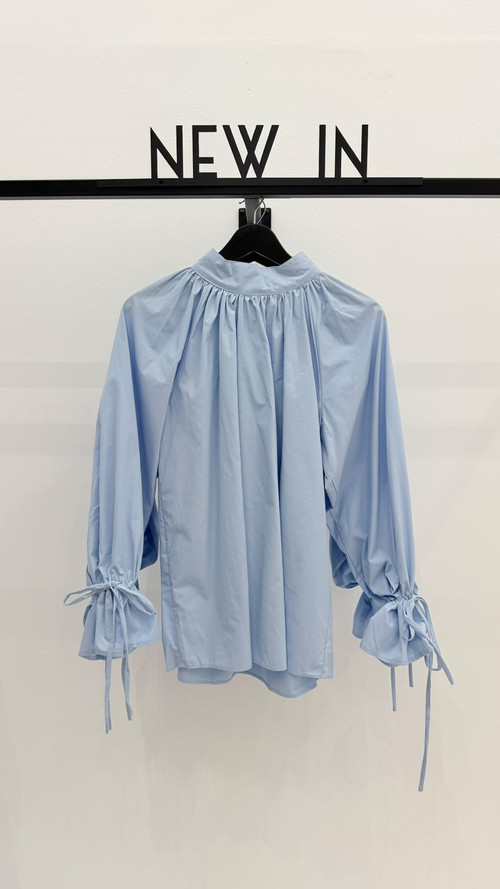 Blusa azul celeste puño recogido