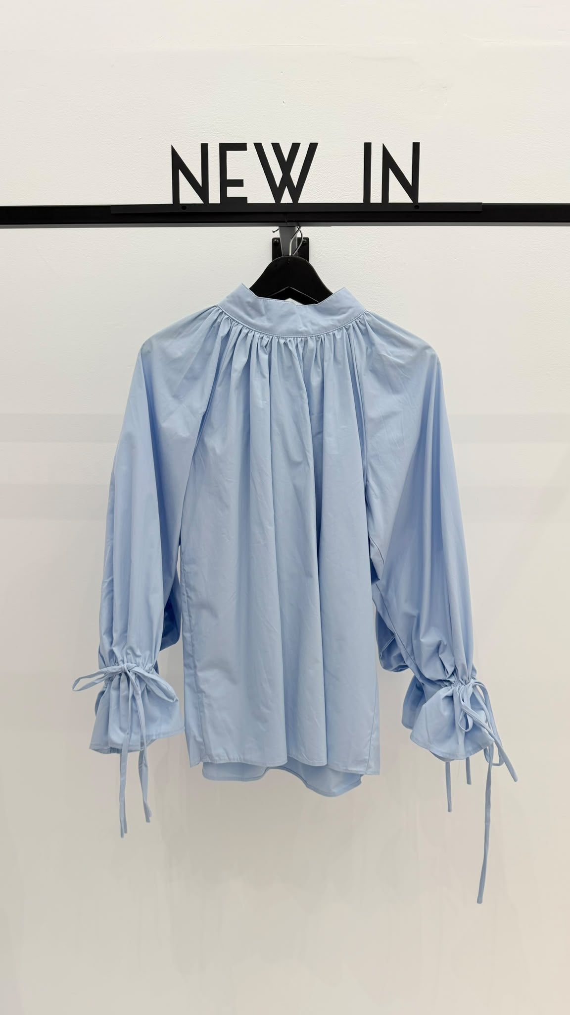 Blusa azul celeste puño recogido